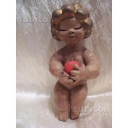 Thun putto bambino con mela